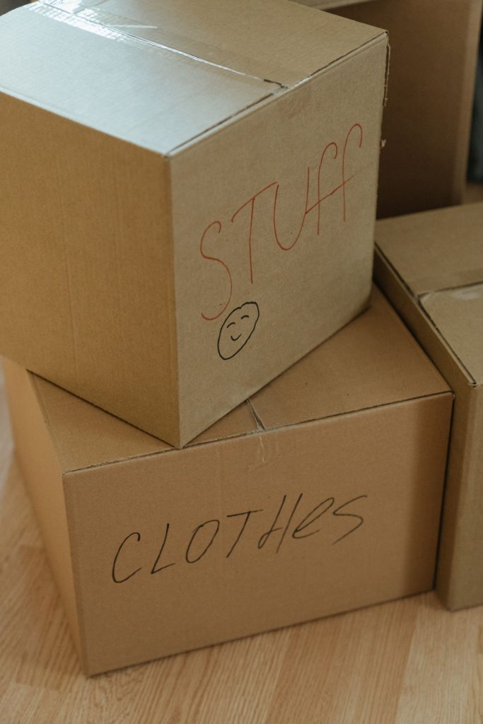 Stacked and labeled moving boxes ready for packing