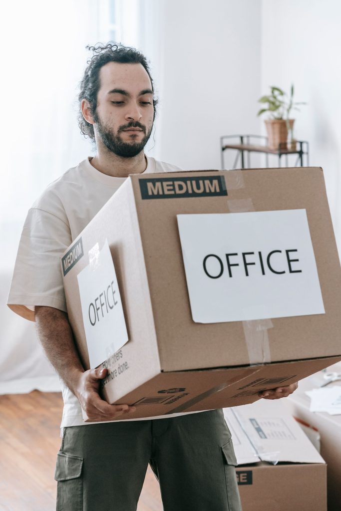 Labeled boxes staged for an office move