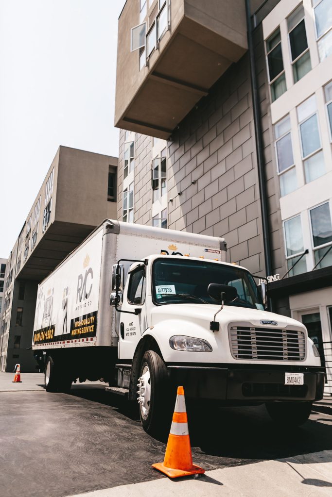 Clean, well-maintained moving van parked outside a building